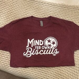 Women’s Maroon Graphic T-Shirt “Mind Yer Own Biscuits” size Medium. NEW